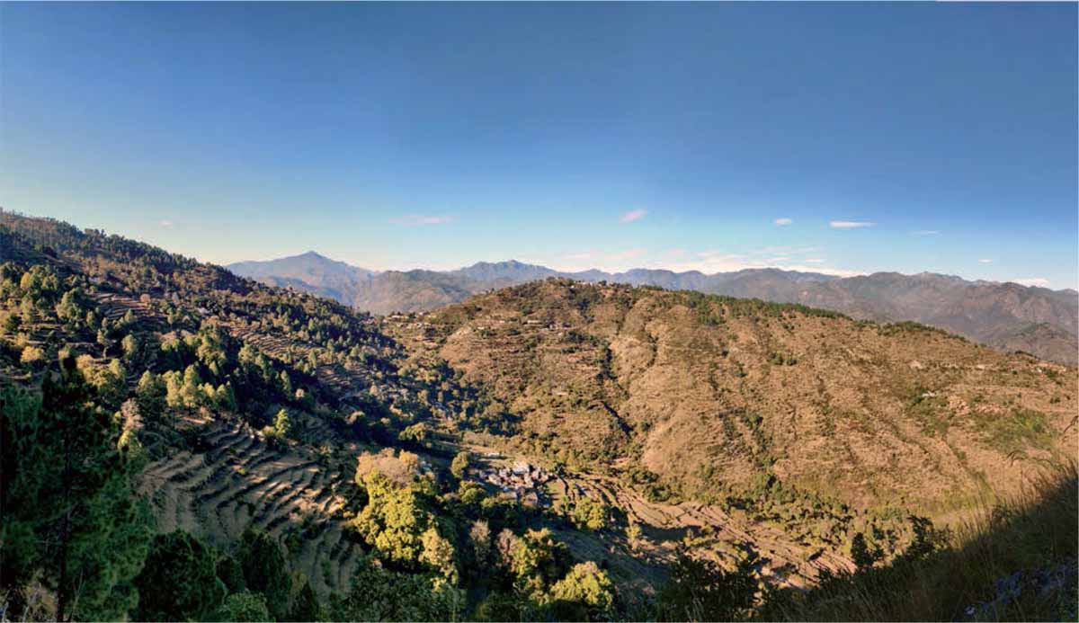 Small-development-initiatives-rural-Himalayan-communities-Uttarakhand-village-mid-slope-forest-above-agriculture-fields-spread-settlement