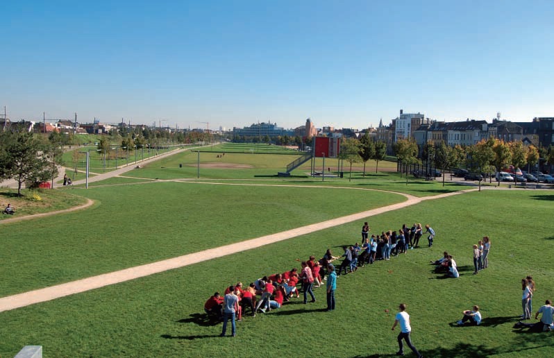 Reclaiming-a-City’s-Industrial-Backyard-people-green-lawns-interact