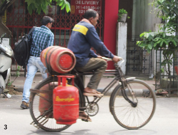 Pedal-Power-Bajinder-provision-carry-upto-5-gas-cylinders-trips-radius-3-kms-cycles-used-delivery-cylinders-owned-men-agency
