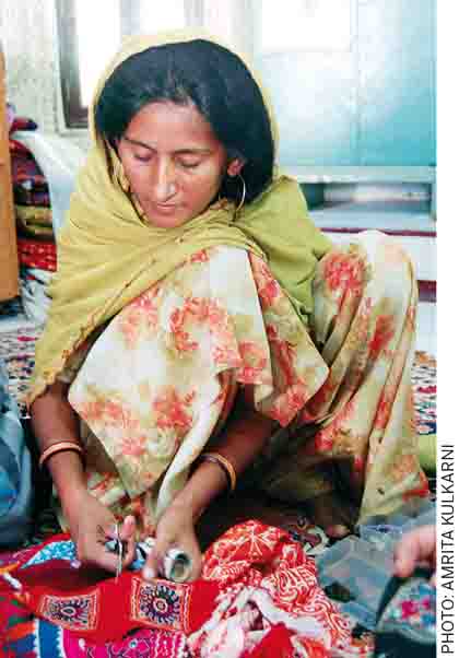 Defining-Future-Past-Instant-photography-pioneered-Edwin-Land-Poloroid-Corporation-craftswoman-embroidered-wares-Bhuj-Gujarat-India